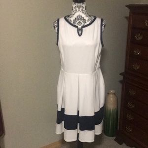 Sleeveless cream and navy dress